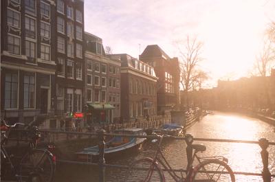 amsterdam in a nutshell -- canals, a bicycle, narrow old buildings