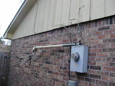 side of house with electric meters